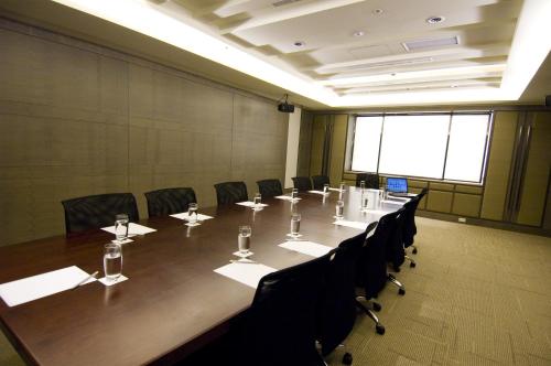 a large conference room with a long table and chairs at Urban Hotel33 in Kaohsiung