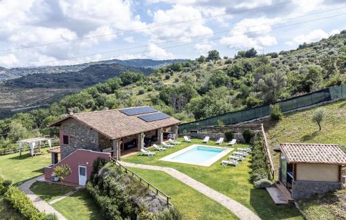 an external view of a house with a swimming pool at Pet Friendly Home In Torchiara in Torchiara