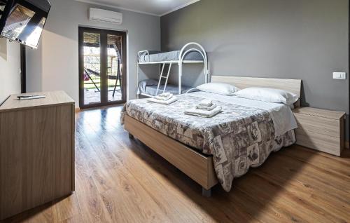 a bedroom with a bed with a iron frame at Pet Friendly Home In Torchiara in Torchiara