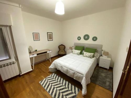 En eller flere senge i et værelse på Amplio alojamiento guerrilleros centro