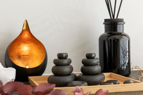 a table with a group of stones and a vase at Titlis Resort in Engelberg