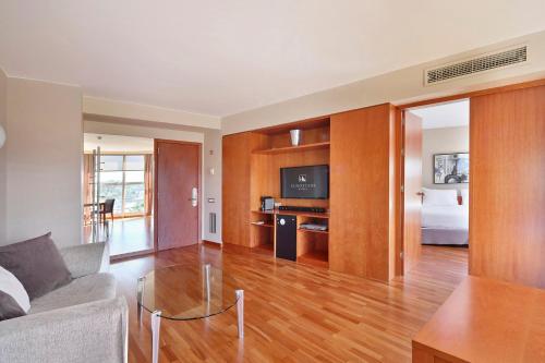 a living room with a couch and a table at Eurostars Don Cándido in Terrassa