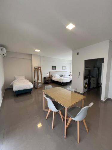 a room with a table and chairs and a bed at PentHouse nuevo y equipado in Santiago del Estero