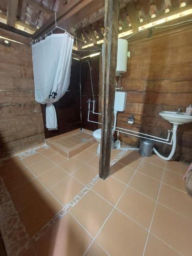 a bathroom with a toilet and a sink at Vegimir, vegansko etno selo Vrbeta in Rankovići