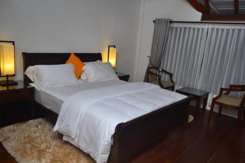 斯里蘭卡努沃勒埃利耶天空微風別墅房間的床