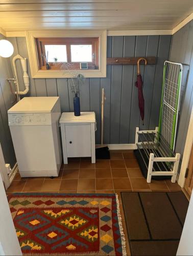 a small room with a rug on the floor at Farm stay in cozy cabin at Vestre Kinn in Ørje