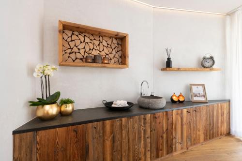 a wooden counter in a room with someooky items on it at Titlis Resort in Engelberg