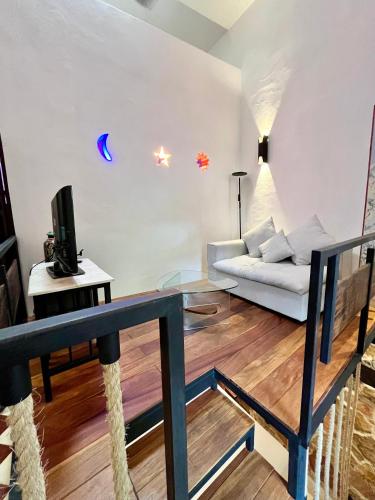 a living room with a couch and a table at VILLA MERIDA BOUTIQUE HOTEL - Adults Only in Mérida