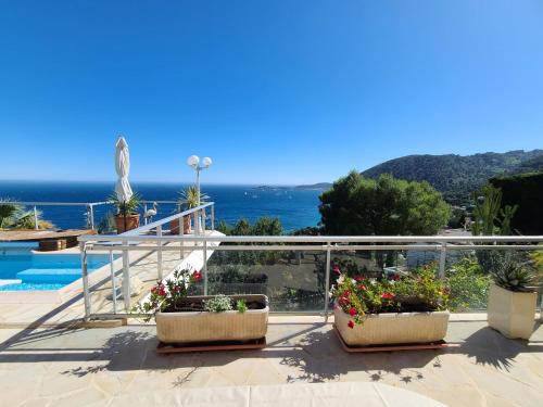 a view of the ocean from the balcony of a house at Eze sur mer - vue Saint Jean Cap Ferrat in Èze