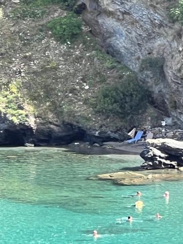 a group of people swimming in a body of water at Bella Vista in Balíon