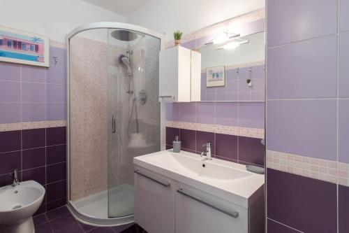a bathroom with a sink and a shower at A10 - 1 BDR Heart of Juan les Pins 5 min Sea - AC & Balconies in Antibes