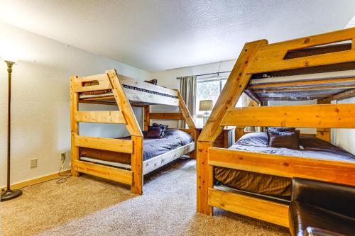 two bunk beds in a room with a ladder at Winter Park Condo w/ Resort Shuttle On-Site! in Winter Park