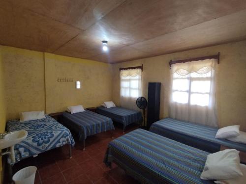 Lova arba lovos apgyvendinimo įstaigoje Yaxlik River Lodge