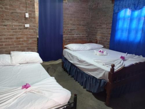 Postel nebo postele na pokoji v ubytování Hostal Y Restaurante El Escondite