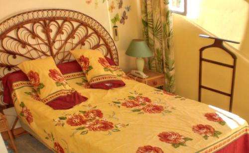 a bedroom with a large bed with red pillows at 3 bedrooms house at Grand Baie 500 m away from the beach with private pool enclosed garden and wifi in Grand-Baie