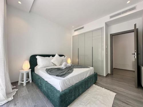 Giường trong phòng chung tại Athéna Appartement