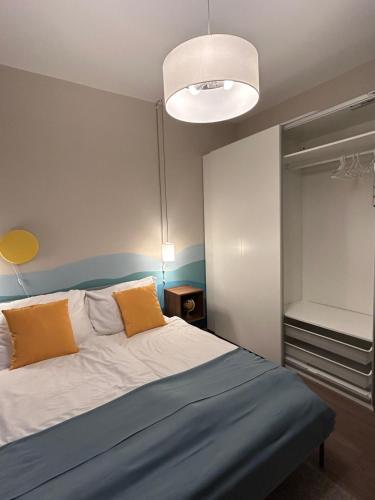 Postel nebo postele na pokoji v ubytování Buda Bay Apartments