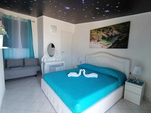 Letto o letti in una camera di Cassiopea B&B Marina di Camerota SA