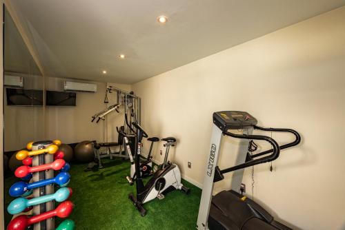 a room with a gym with exercise equipment at Arosa Rio Hotel in Rio de Janeiro