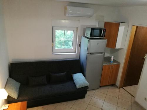 Kuchyň nebo kuchyňský kout v ubytování Studio apartman BETA - Silba