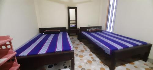 Voodi või voodid majutusasutuse Lucy Resort toas