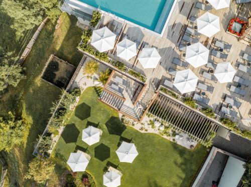 an overhead view of a building with a garden at Hotel Alpenflora in Castelrotto