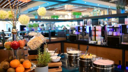 a table with food on it in a restaurant at Motel Plus Berlin in Berlin