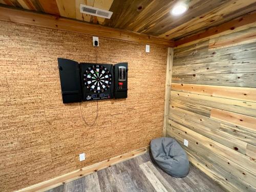 a room with a dart board on a wall at Experience luxury at Smoky Mountain Hideaway, just 5 miles from downtown Gatlinburg in Gatlinburg