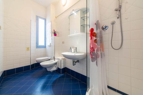 a bathroom with a sink and a toilet and a shower at Il Villaggio di ABITABO in Bologna
