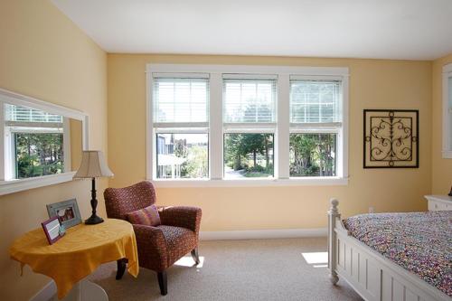a bedroom with a bed and a table and a chair at Once Upon A Time by Seabrook Hospitality in Pacific Beach