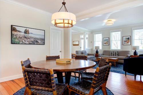 a dining room with a table and chairs at Our Family Beach House by Seabrook Hospitality in Pacific Beach