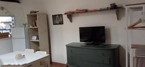 A television and/or entertainment centre at Palazzo Saraceno apartments-Antico Rifugio