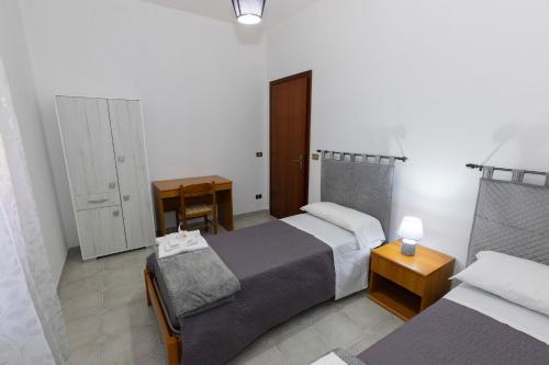A bed or beds in a room at La Casa di Nonna