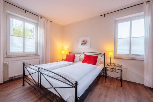 Postel nebo postele na pokoji v ubytování Wintergartenhaus Braunlage