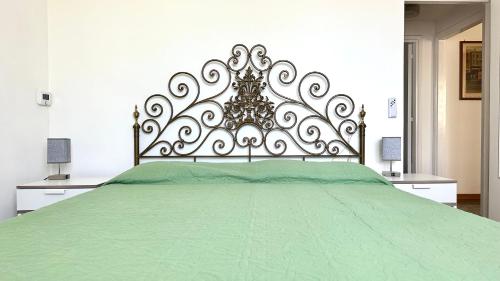 Postel nebo postele na pokoji v ubytování M404 - Marcelli, trilocale con giardino a due passi dal mare