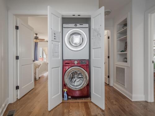 a washer and dryer sitting inside of a room at C-Maid in Surf City