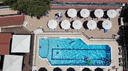 an overhead view of a swimming pool with surfboards at Zante Palace in Tsilivi
