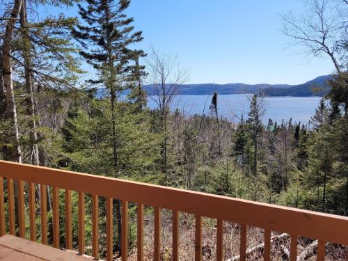 a view of a lake from the deck of a house at Centre de Vacances 5 Étoiles Family Resort in Sacré-Coeur-Saguenay