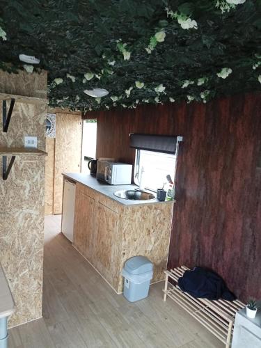 a kitchen with a sink and a counter top at 6 Headwards Glamping Retreat in Hemsby