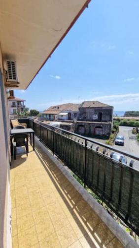 a balcony of a building with a view of a highway at Home Sicilian Gallery in Aci Castello