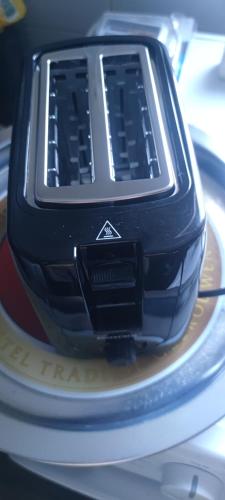 a close up of a cell phone sitting on a plate at Seoski Turizam Feniks - apartman Ostrog in Kosjerić