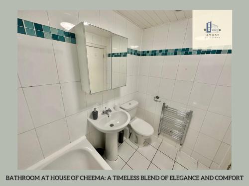a white bathroom with a sink and a toilet at The Chambers Presents Long stay Offers in Leeds