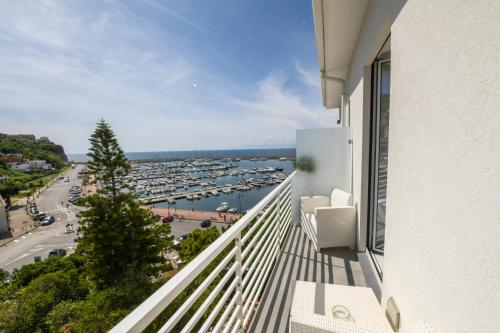 a balcony with a view of a harbor at Donna Adriana Rooms in Agropoli