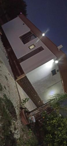 a building with a lit up door at night at U Ranatu in San Paolo