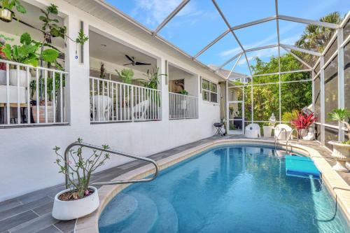 a swimming pool in the middle of a house at Privacy Pool Gulf Access and Luxury in Bonita Springs