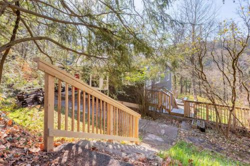 a wooden fence in front of a house at Serene Catskills Retreat with Deck in Woodbourne