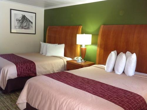Cama ou camas em um quarto em Pilgrim Inn & Cottages