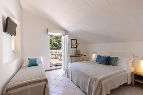 Postel nebo postele na pokoji v ubytování Hotel Adriatica con Piscina