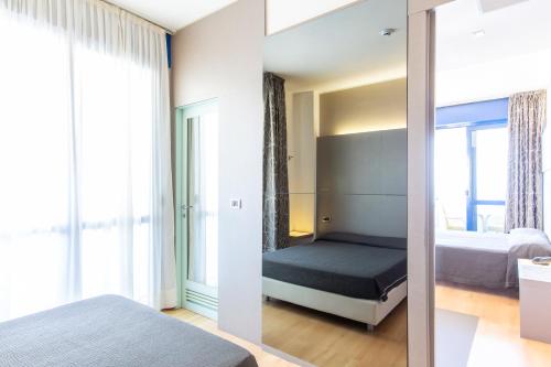 Cama o camas de una habitación en Hotel Baltic Riccione-Fronte Mare