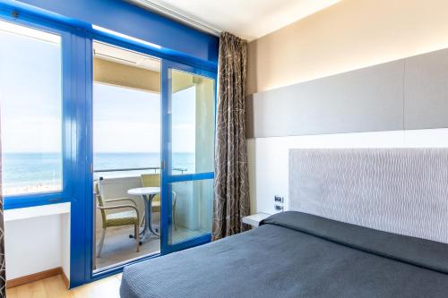Cama o camas de una habitación en Hotel Baltic Riccione-Fronte Mare